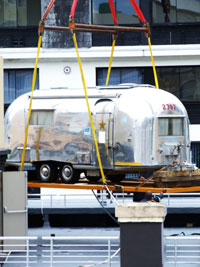 Airstream hoisted to roof of S. Africa Hotel