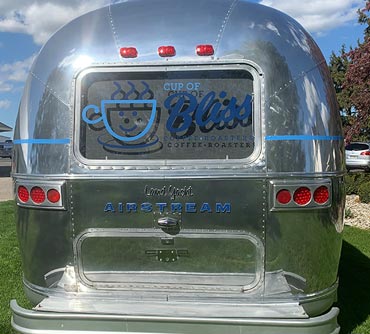 Rear vinyl graphics Cup of Bliss coffee roaster Airstream vending trailer