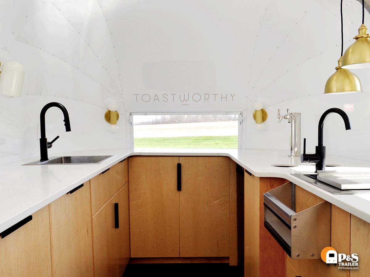 roomy Toastworthy Airstream Bar with sinks and speed rail