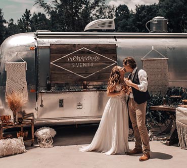 bridge and groom by Airstream trailer