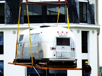 Airstream hoisted to roof of S. Africa Hotel